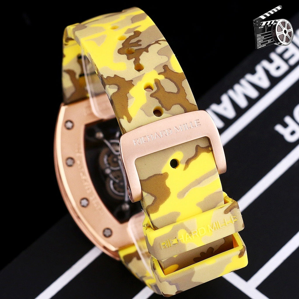 Richard Mille watch with rose-gold case and yellow camouflage strap, side close-up.