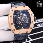 Richard Mille watch with rose-gold case and black silicone strap, skeleton dial.