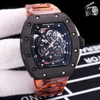 Orange camo rubber strap watch with black case and skeleton dial with silver gears.
