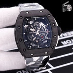 White camo rubber strap watch with black case and skeleton dial with exposed gears.