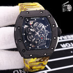 Yellow camo rubber strap watch with black case and skeleton dial with exposed mechanics.