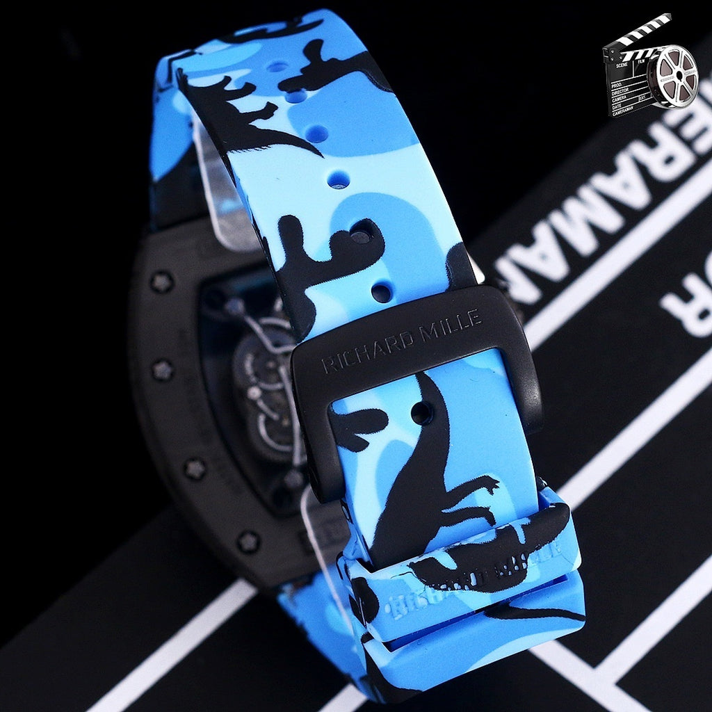 Blue camo rubber strap watch side view with black case and metal buckle.