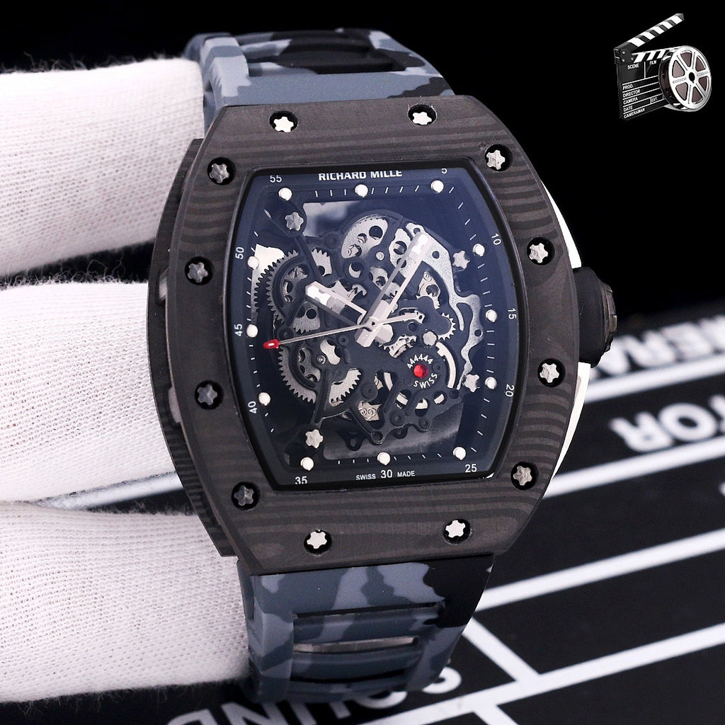 Dark skeleton dial watch with black case and gray camouflage rubber strap.