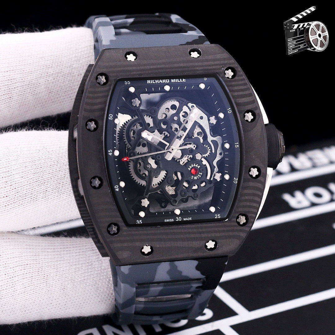 Dark skeleton dial watch with black case and gray camouflage rubber strap.