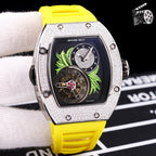 Silver-toned watch with yellow silicone strap; dark dial with green leaf art and skeleton movement.