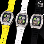 Watch trio with yellow, white, and black silicone straps; silver-toned cases and patterned dark dials.