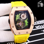Richard Mille watch with rose-gold case and yellow silicone strap, skeleton dial detail.