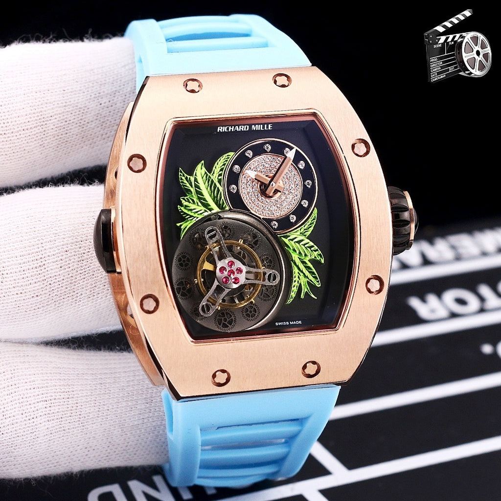 Richard Mille watch with rose-gold case and light blue silicone strap, skeleton dial detail.