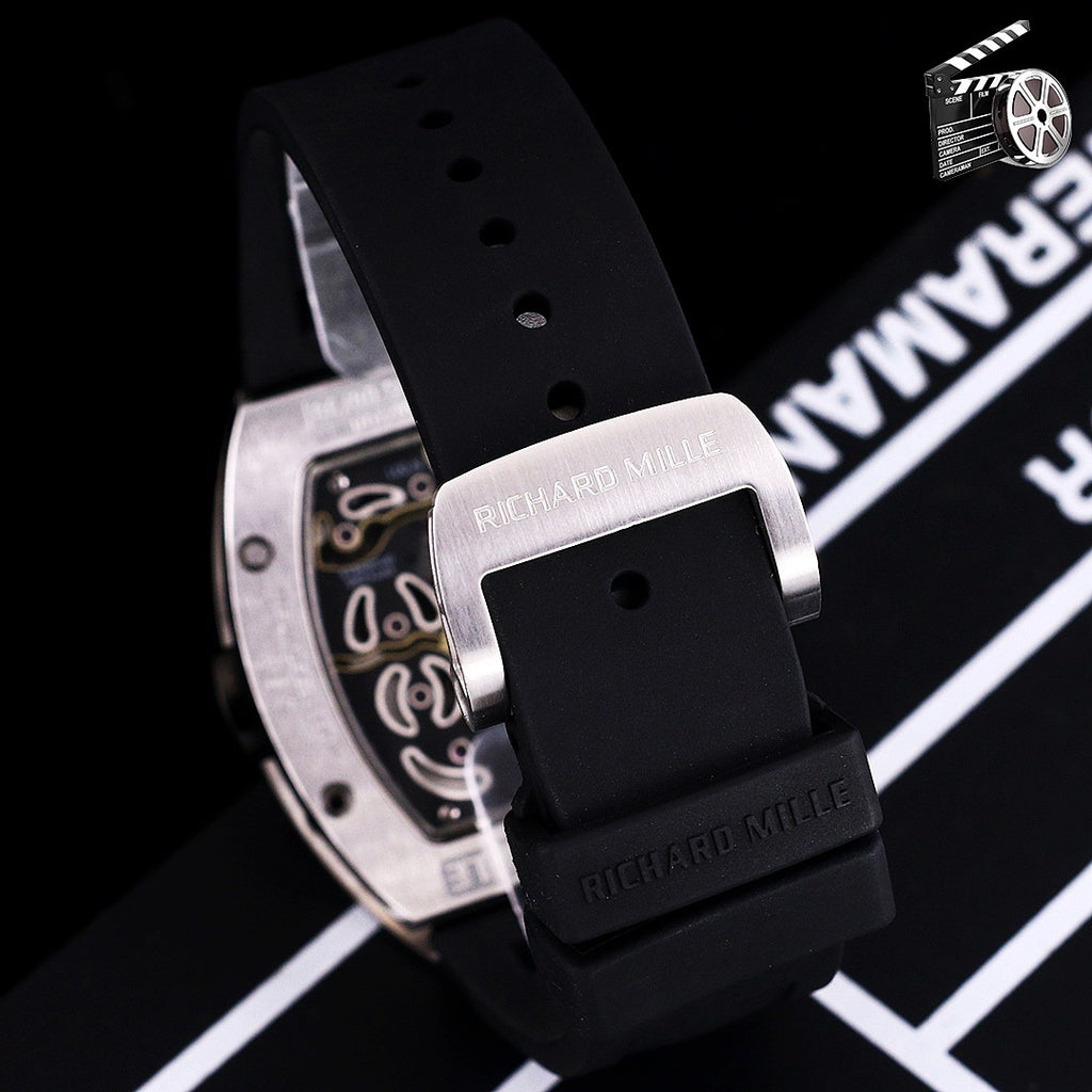 Richard Mille watch side profile with black silicone strap and stainless-steel case