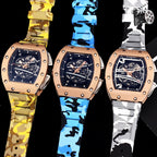 Three Richard Mille watches with rose gold cases and camo rubber straps in yellow, blue, and white.