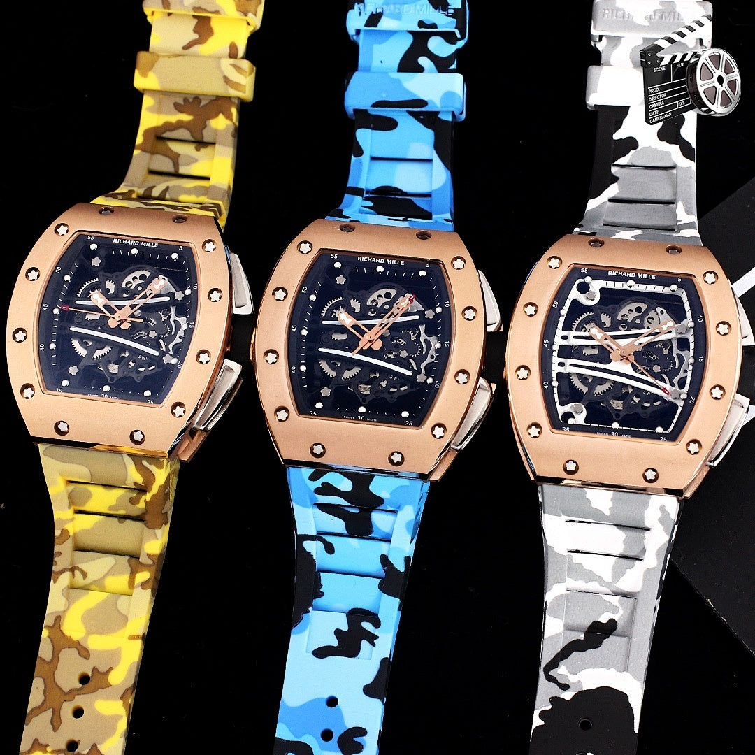 Three Richard Mille watches with rose gold cases and camo rubber straps in yellow, blue, and white.