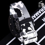 Richard Mille-style watch side view with black case and white/gray camo rubber strap