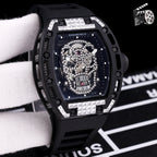 Richard Mille watch with white silicone strap, black case, dark blue jeweled skeleton skull dial