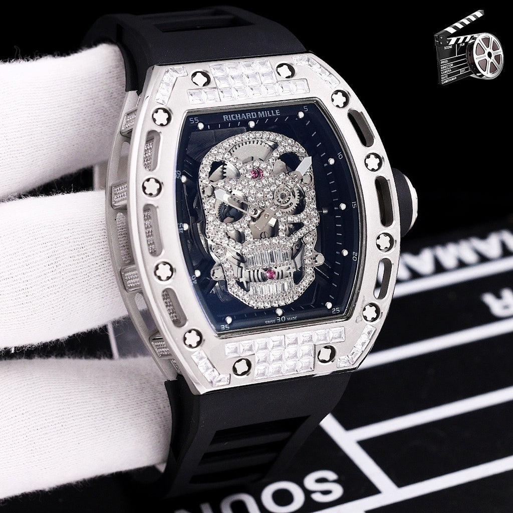 Richard Mille watch with black silicone strap, silver-toned case, jeweled skeleton skull dial