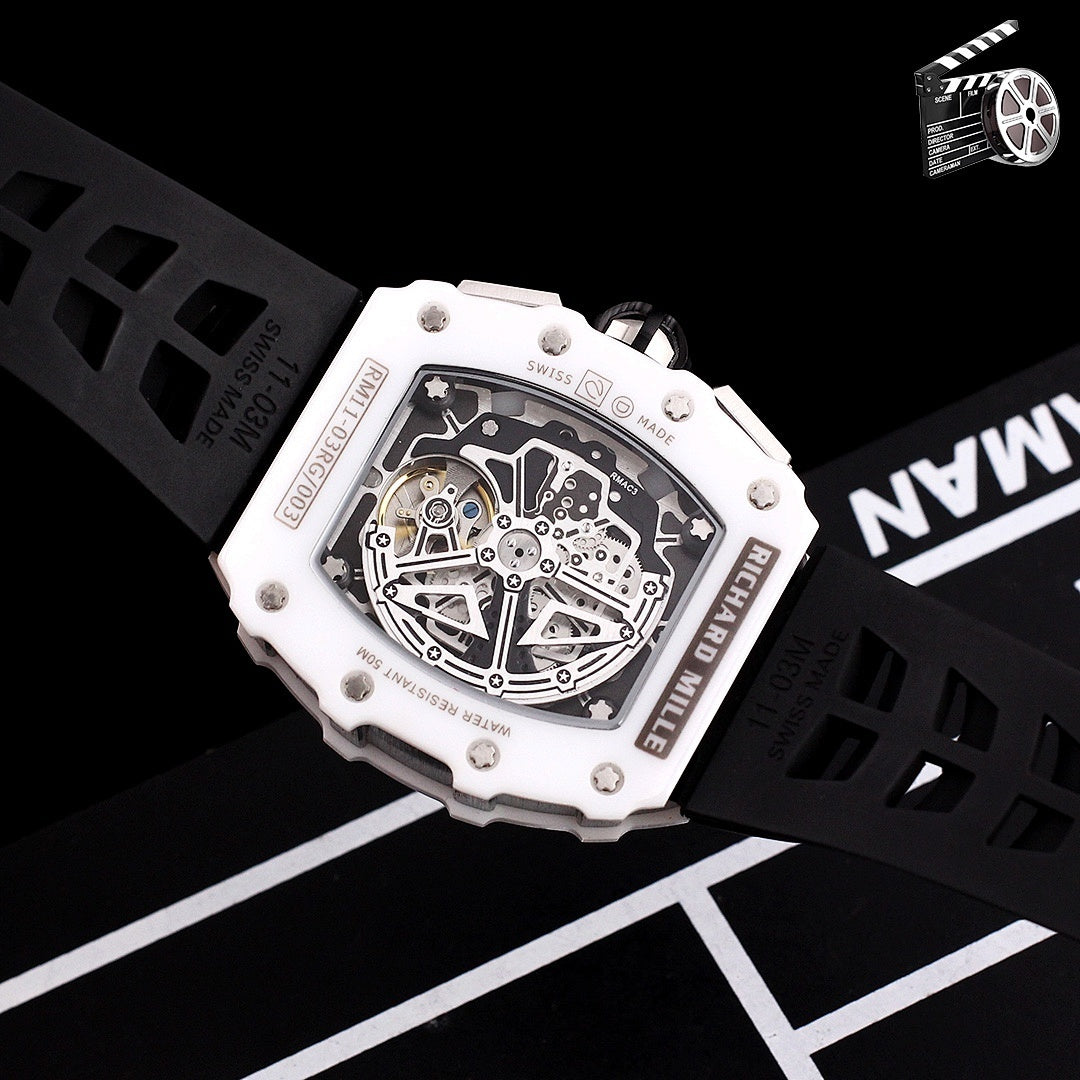 Richard Mille watch caseback, exposed movement on white frame with black silicone strap