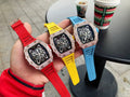 Dual men’s skeleton watch set with jeweled bezels and red, yellow, and blue silicone straps