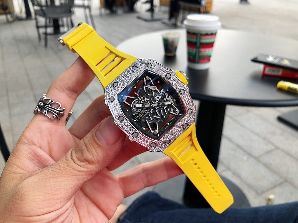 Richard Mille watch with yellow silicone strap and jeweled silver bezel