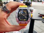 Richard Mille watch with yellow strap, jeweled bezel, and visible skeleton dial