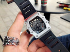Richard Mille watch angled view with black strap and exposed mechanical dial