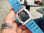 Richard Mille watch close-up of light blue case and strap, showing caseback details.