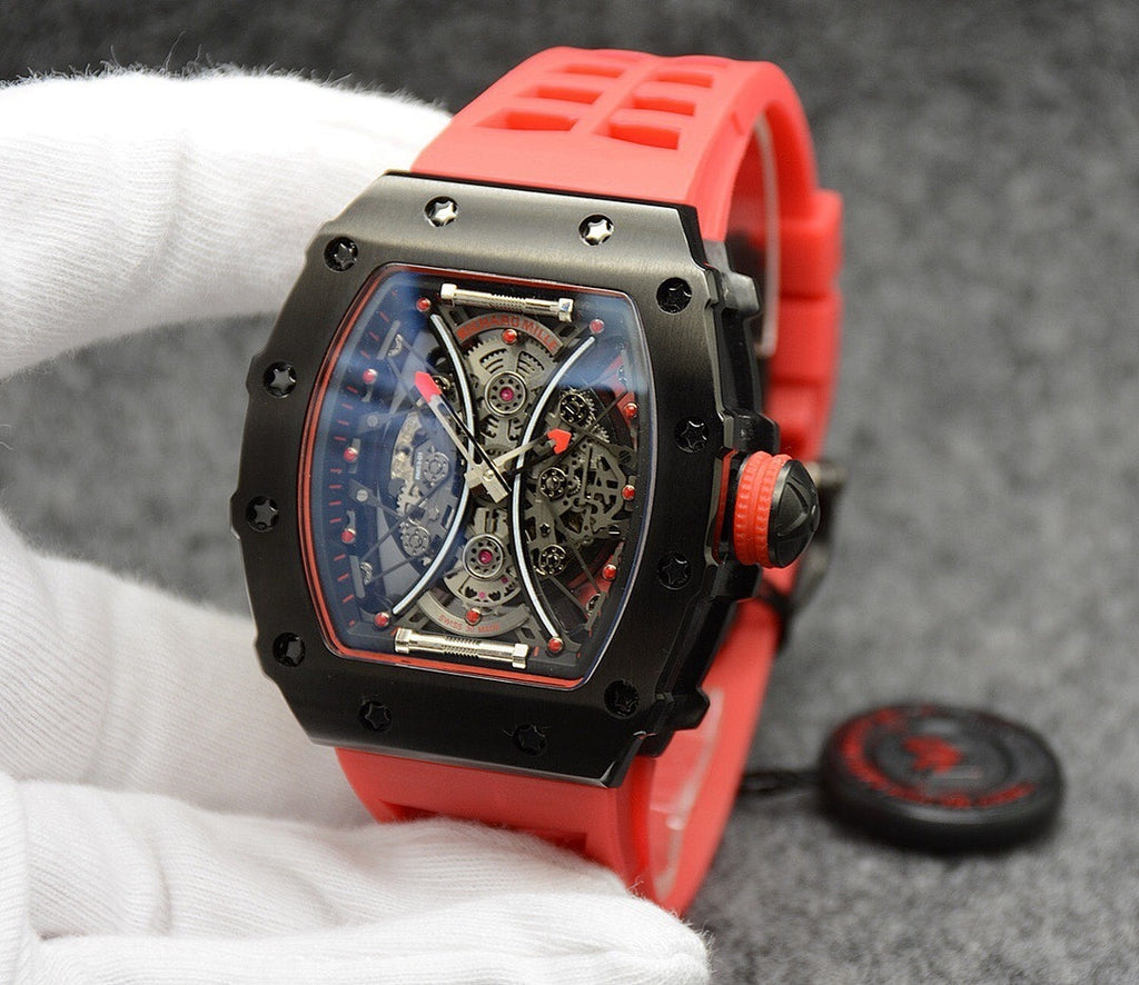 Richard Mille watch with red silicone strap, black case, skeleton dial and crown.