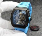 Richard Mille watch with blue silicone strap, black case, skeleton dial detail.