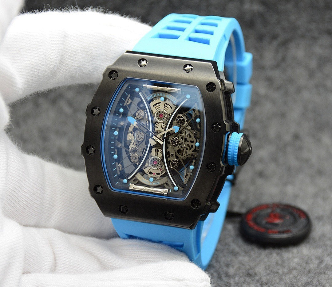 Richard Mille watch with blue silicone strap, black case, skeleton dial detail.