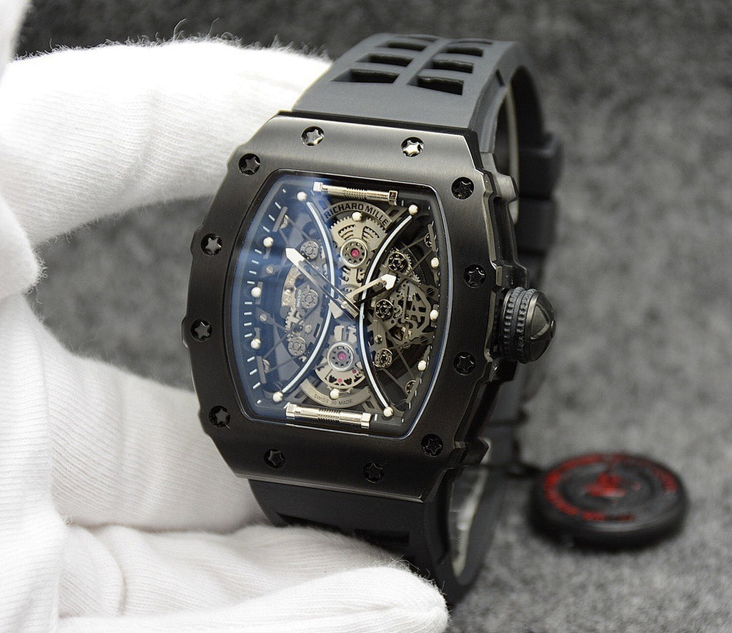 Richard Mille watch with black silicone strap, black case, skeleton dial face.