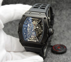 Richard Mille watch with black silicone strap, black case, skeleton dial face.