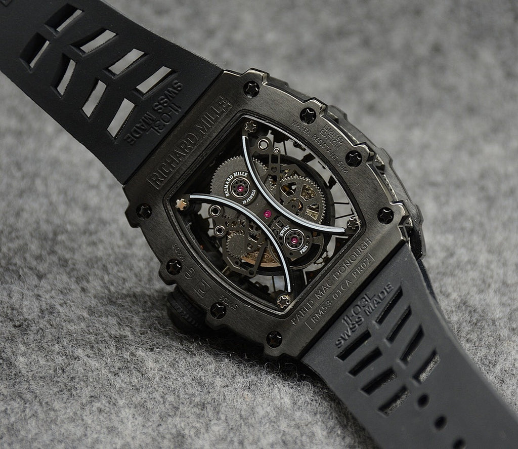 Richard Mille watch with black rubber strap and skeleton dial in dark metal case