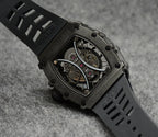Richard Mille watch with black rubber strap and skeleton dial in dark metal case