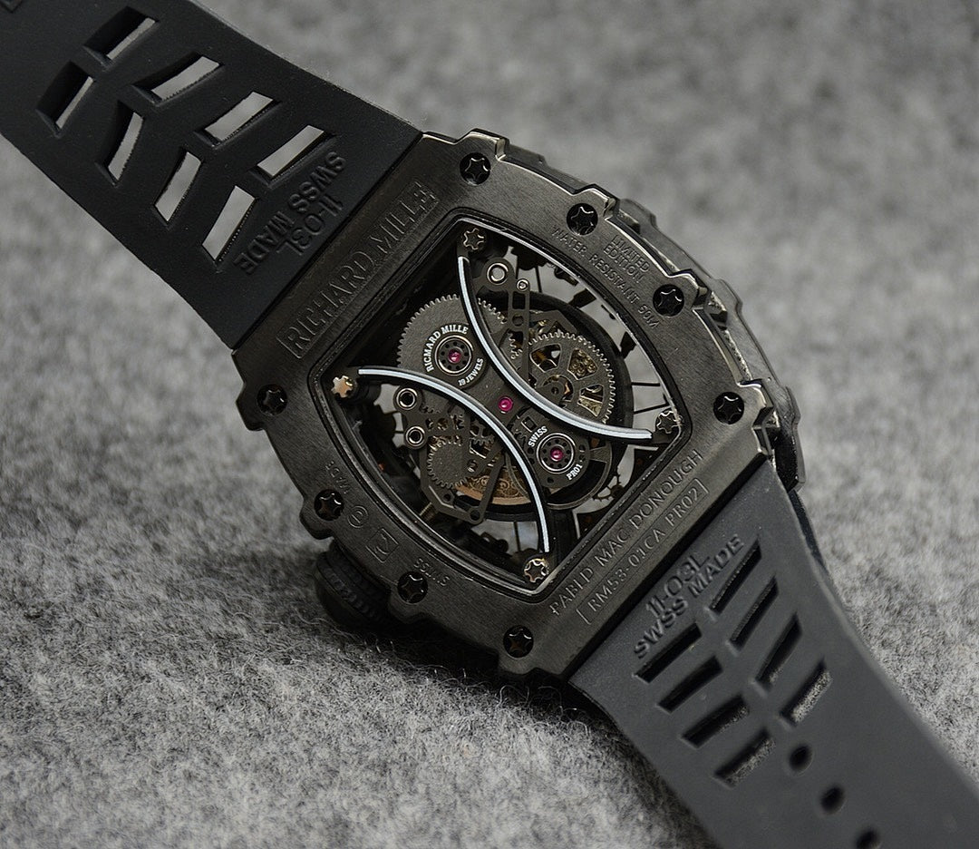 Richard Mille watch with black rubber strap and skeleton dial in dark metal case