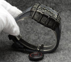 Richard Mille watch showing black textured metal bracelet and case side