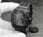 Richard Mille watch with black rubber strap, jeweled bezel, blue skeleton dial