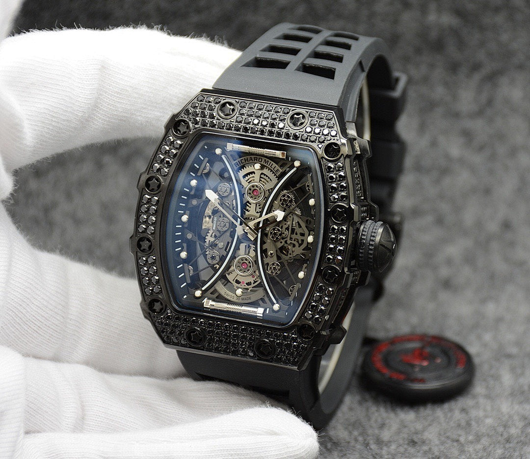 Richard Mille watch with black rubber strap, jeweled bezel, blue skeleton dial