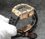 Richard Mille watch with rose gold case and jeweled bezel on black strap