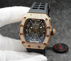 Richard Mille watch with rose gold case and jeweled bezel over blue skeleton dial