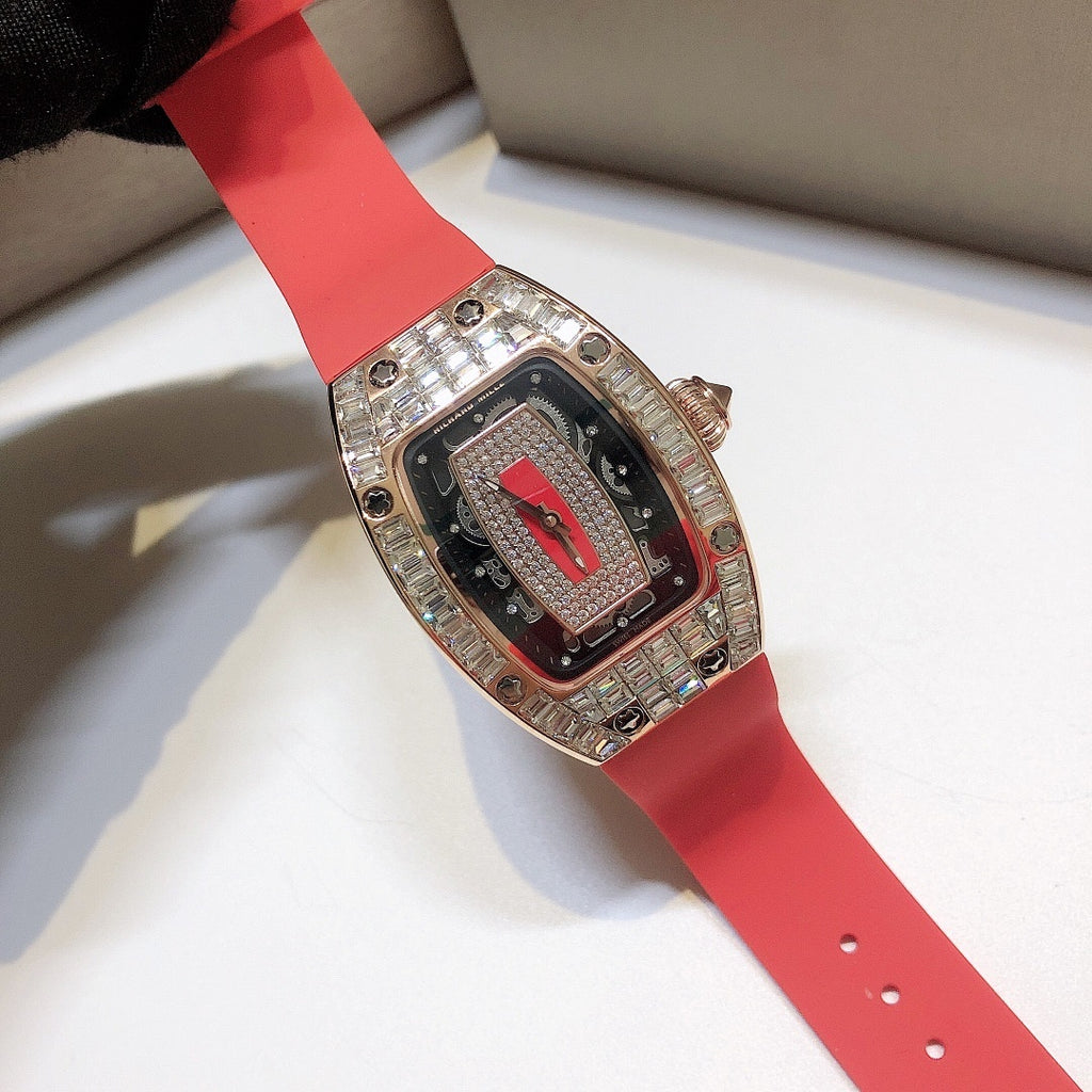 Richard Mille watch on red rubber strap with rose-gold case and gem-set bezel