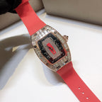 Richard Mille watch on red rubber strap with rose-gold case and gem-set bezel