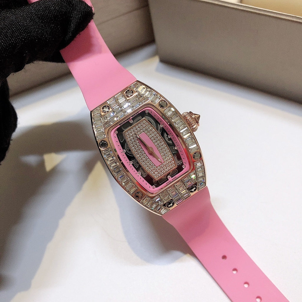 Richard Mille watch on pink rubber strap with rose-gold case and gem-set bezel