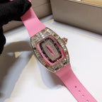 Richard Mille watch on pink rubber strap with rose-gold case and gem-set bezel