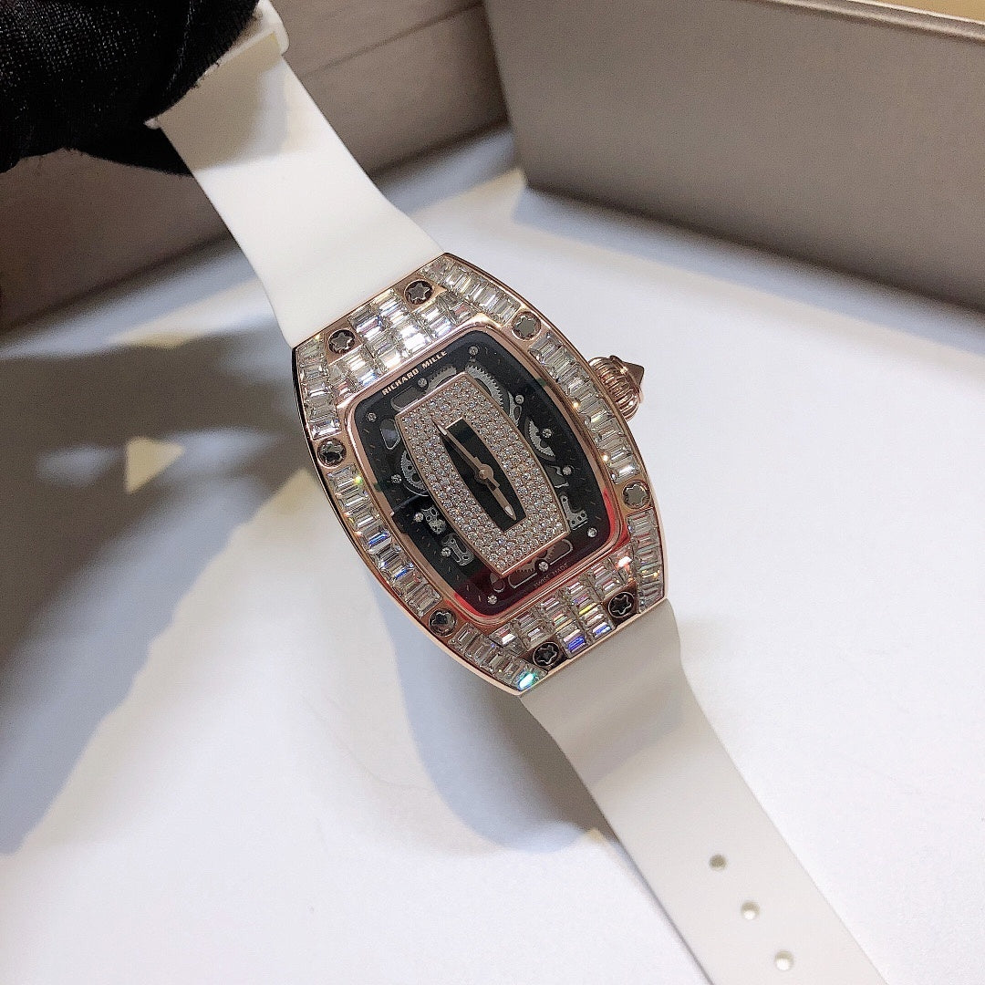 Richard Mille watch with white rubber strap and rose-gold gem-set case