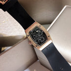 Richard Mille watch with black rubber strap and rose-gold case, skeleton dial visible