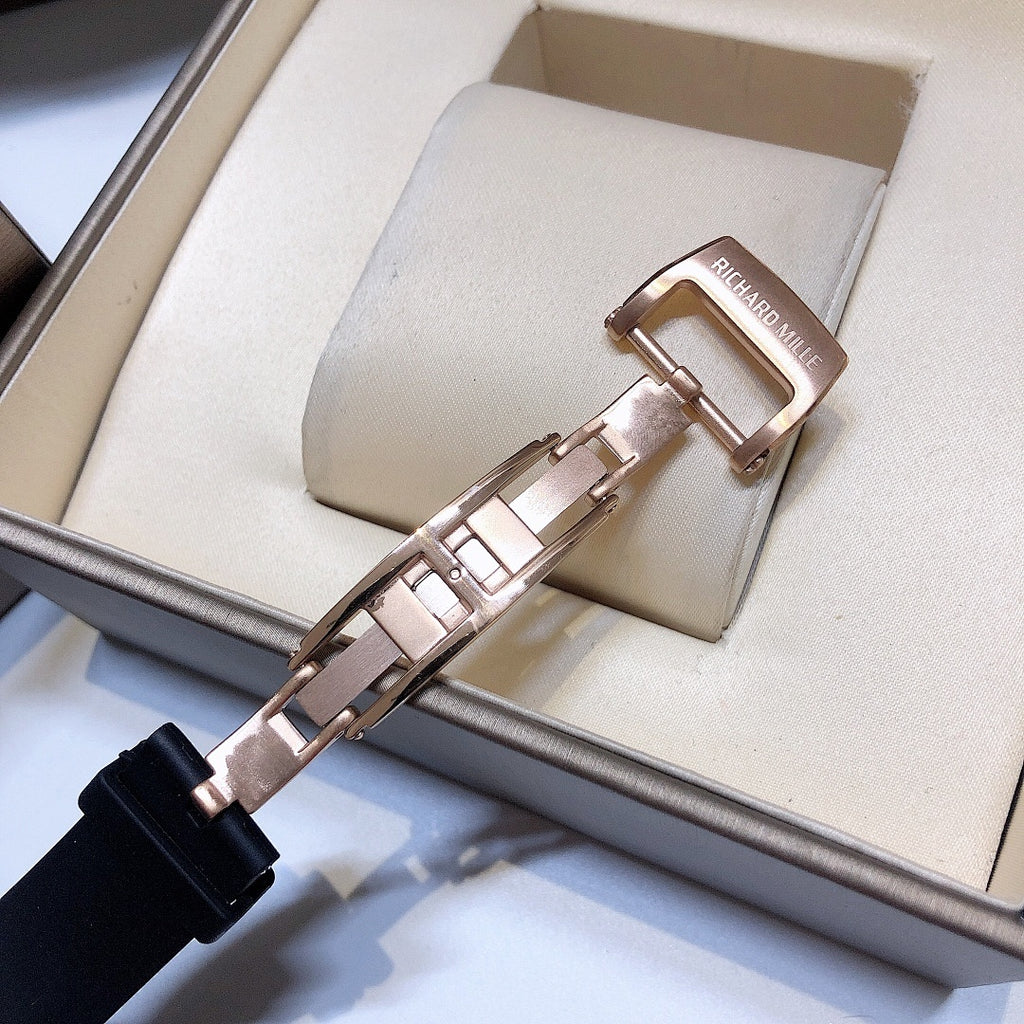 Richard Mille watch strap clasp with rose-gold hardware and black rubber strap