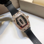 Richard Mille watch with black rubber strap, rose-gold case, and gem-set bezel