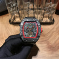 Richard Mille watch with black case, skeleton dial, red bezel, on black strap