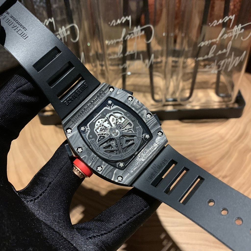 Richard Mille watch back view on black strap, round copper accents, engraved case