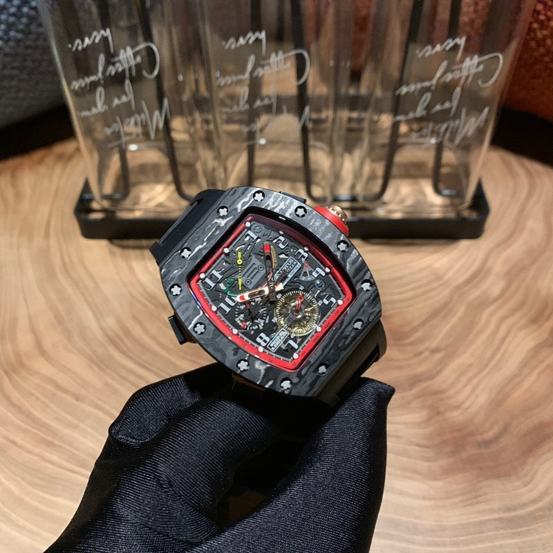 Richard Mille watch front view, black case with red bezel, skeleton dial, black strap