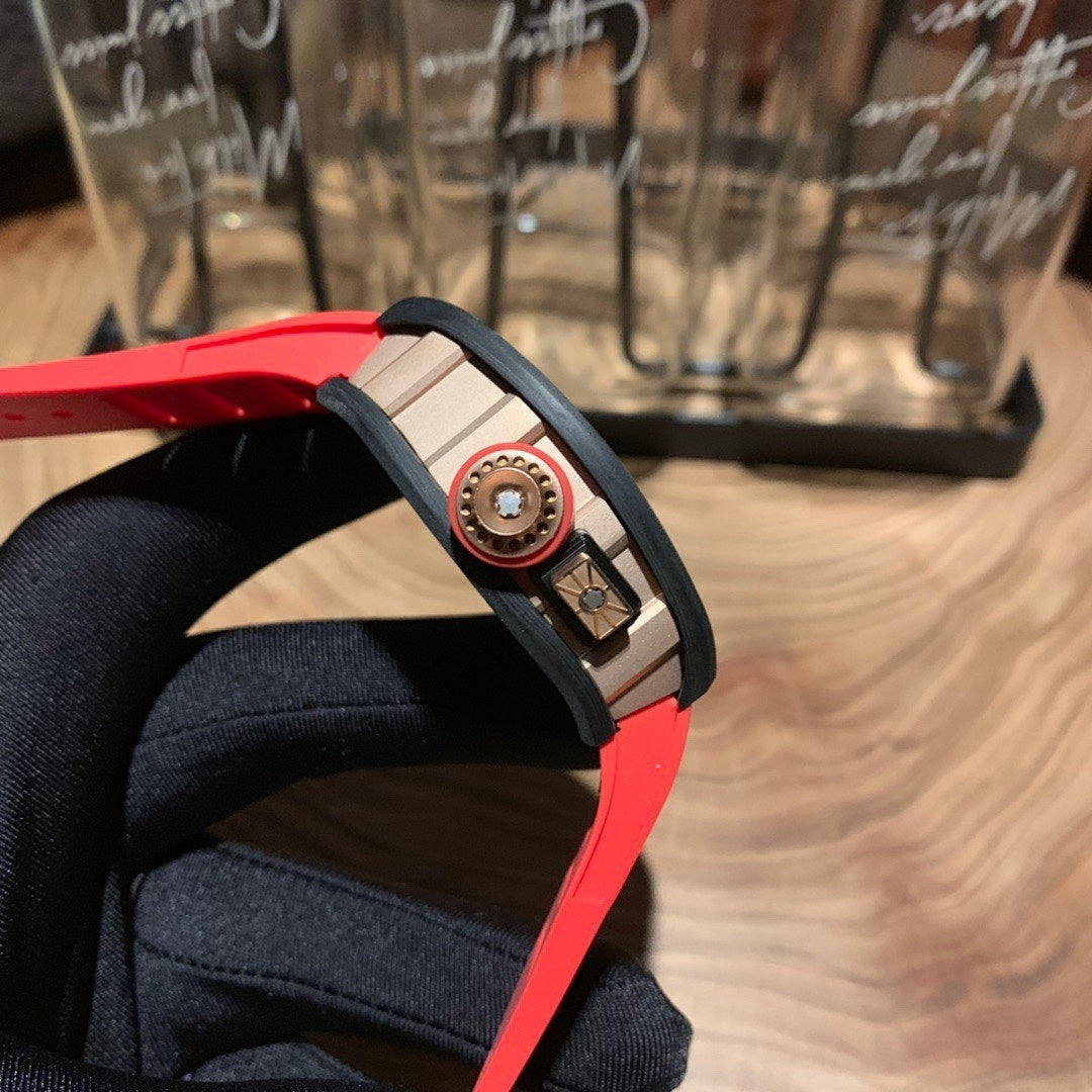 Richard Mille watch side profile, red strap with metal crown and round accents