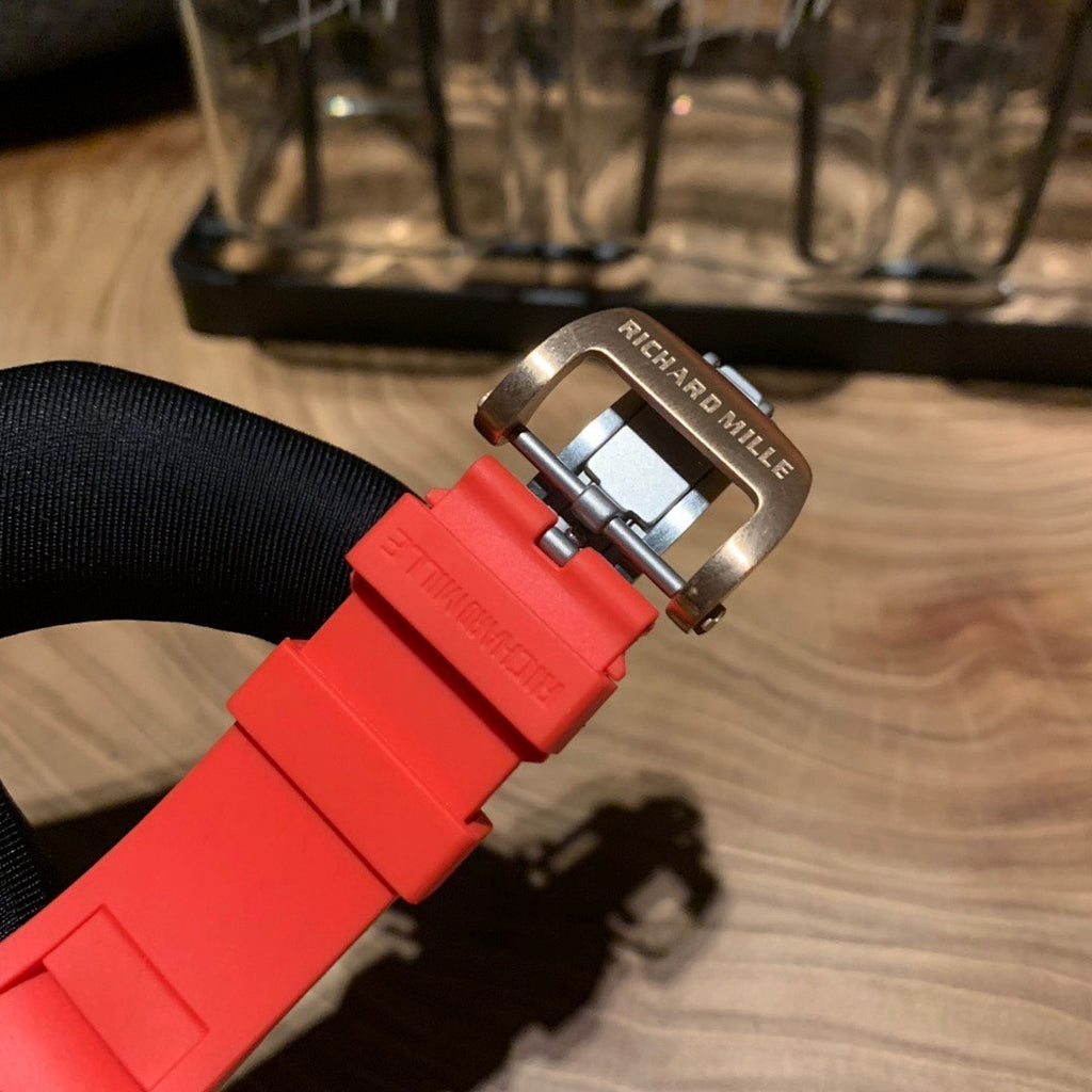 Richard Mille watch buckle, red strap with metal clasp and engraved brand